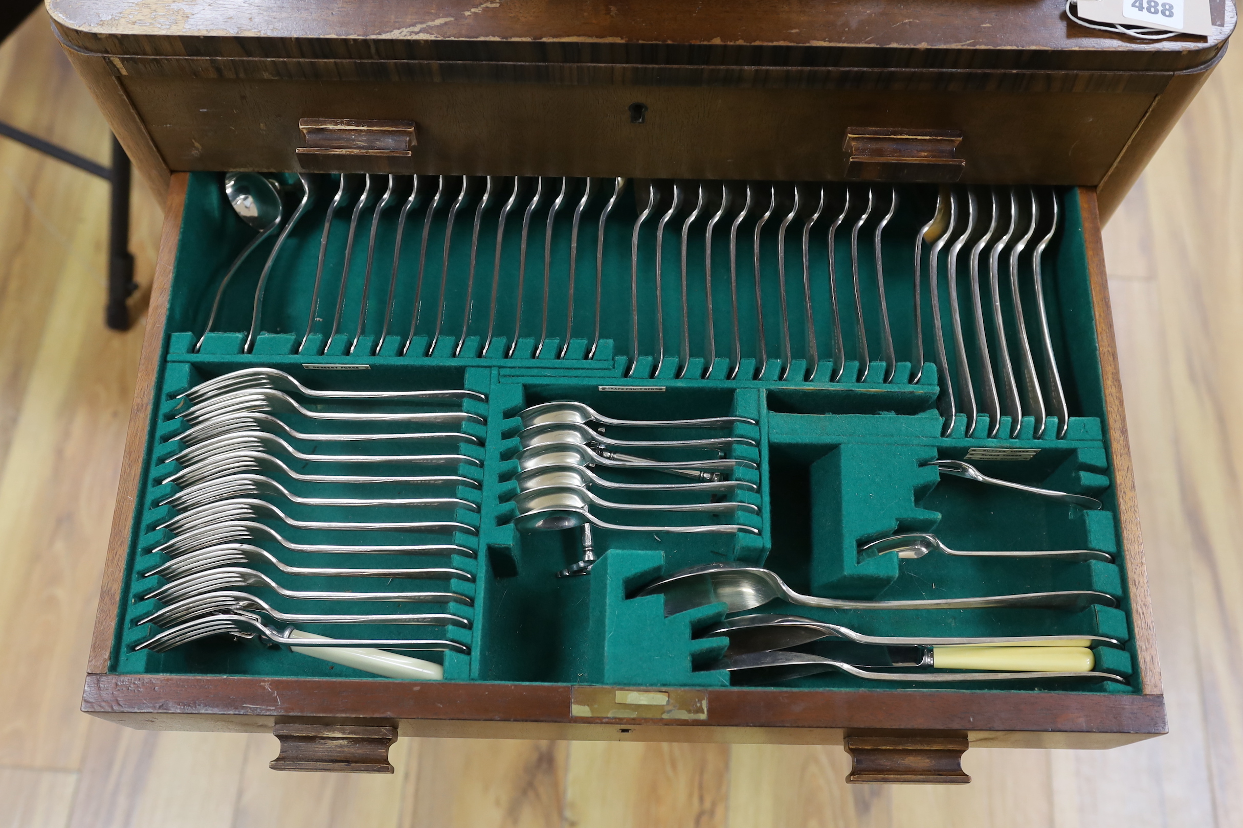 A two drawer canteen of Walker & Hall silver plated cutlery, almost complete, 62cm wide, 77cm high